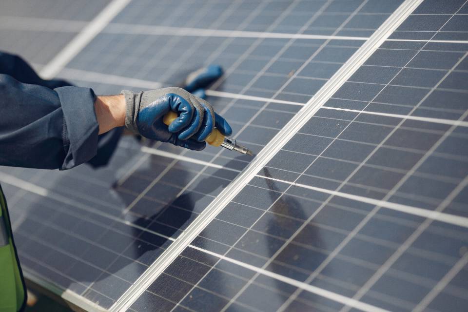 a professional working on the maintenance of solar panel